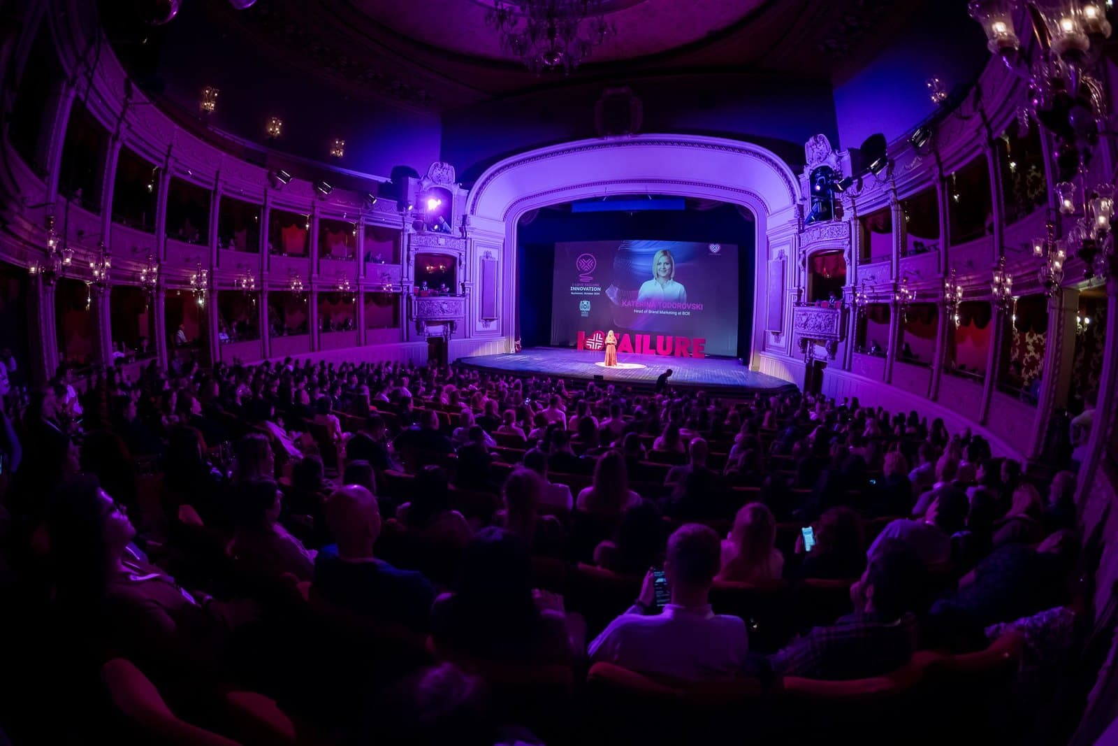 Katerina speaking to a theatre audience